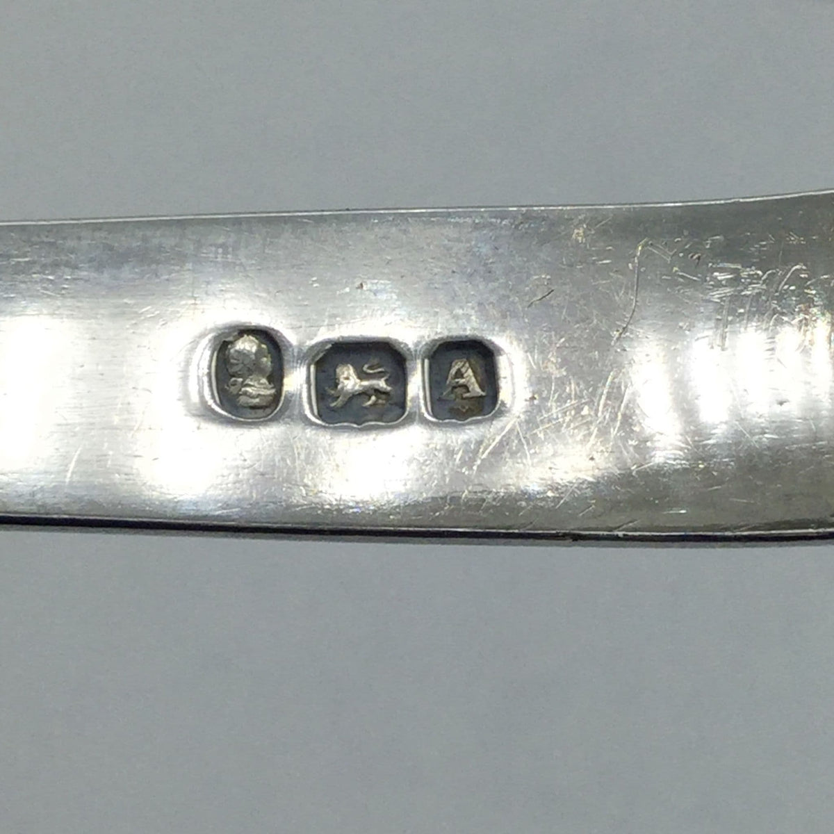Three marks showing georgian head lion passant and A