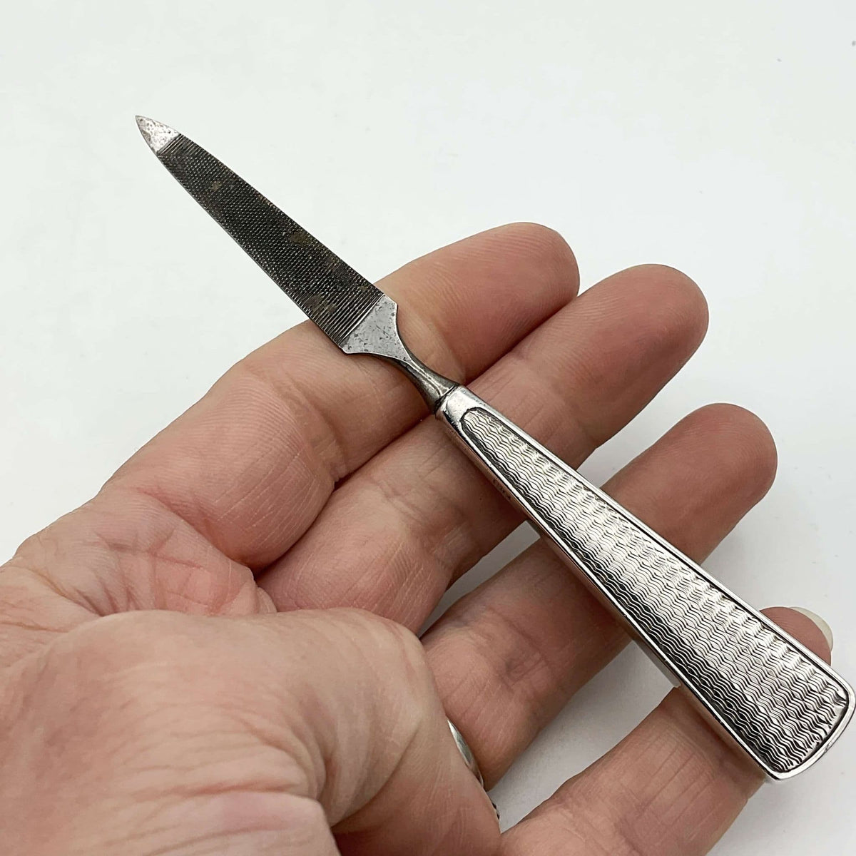 Vintage nail file held in a hand