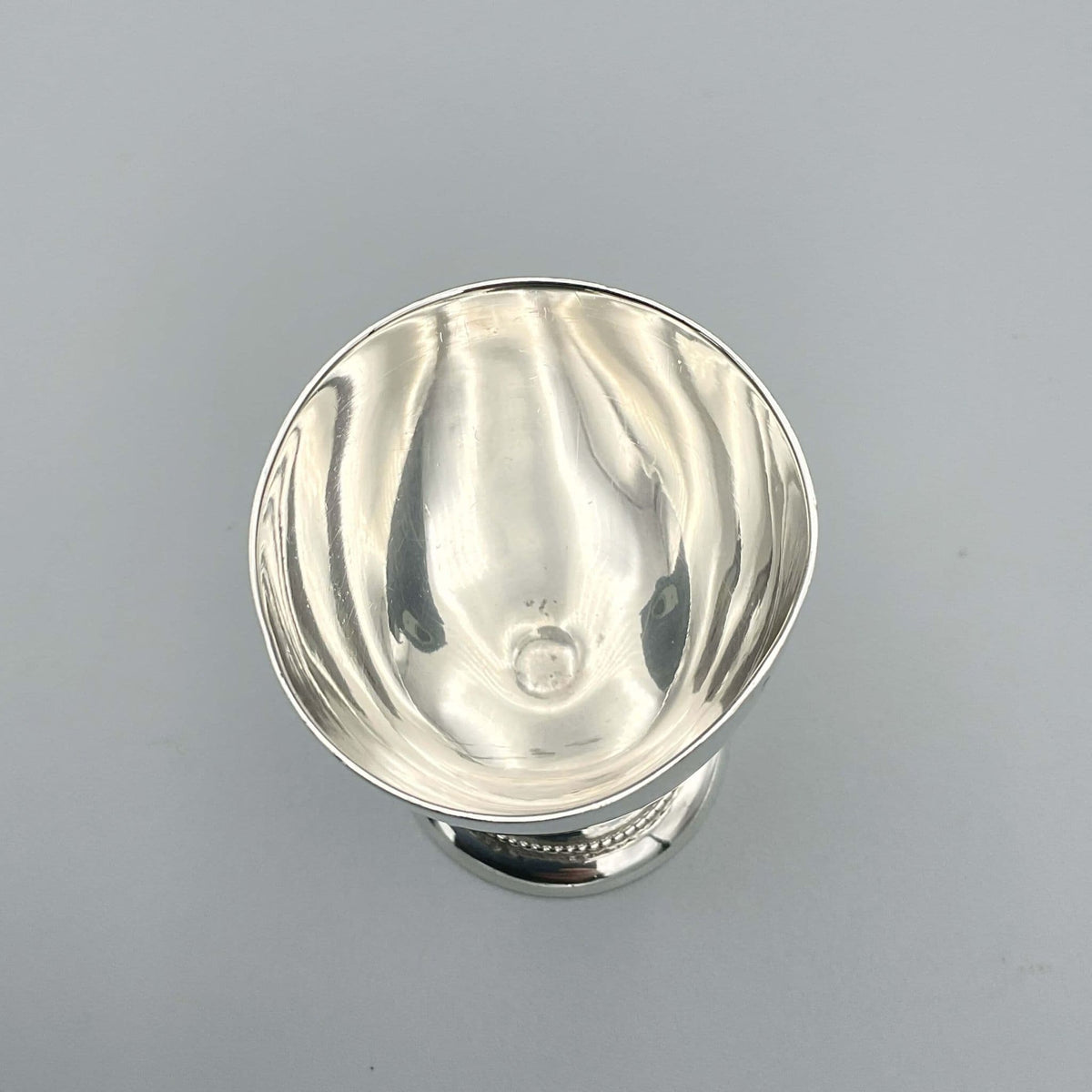 Sterling silver egg cup from 1944 by Beeches Vintage, ideal for christening or baby gift, showing a detailed vintage design.