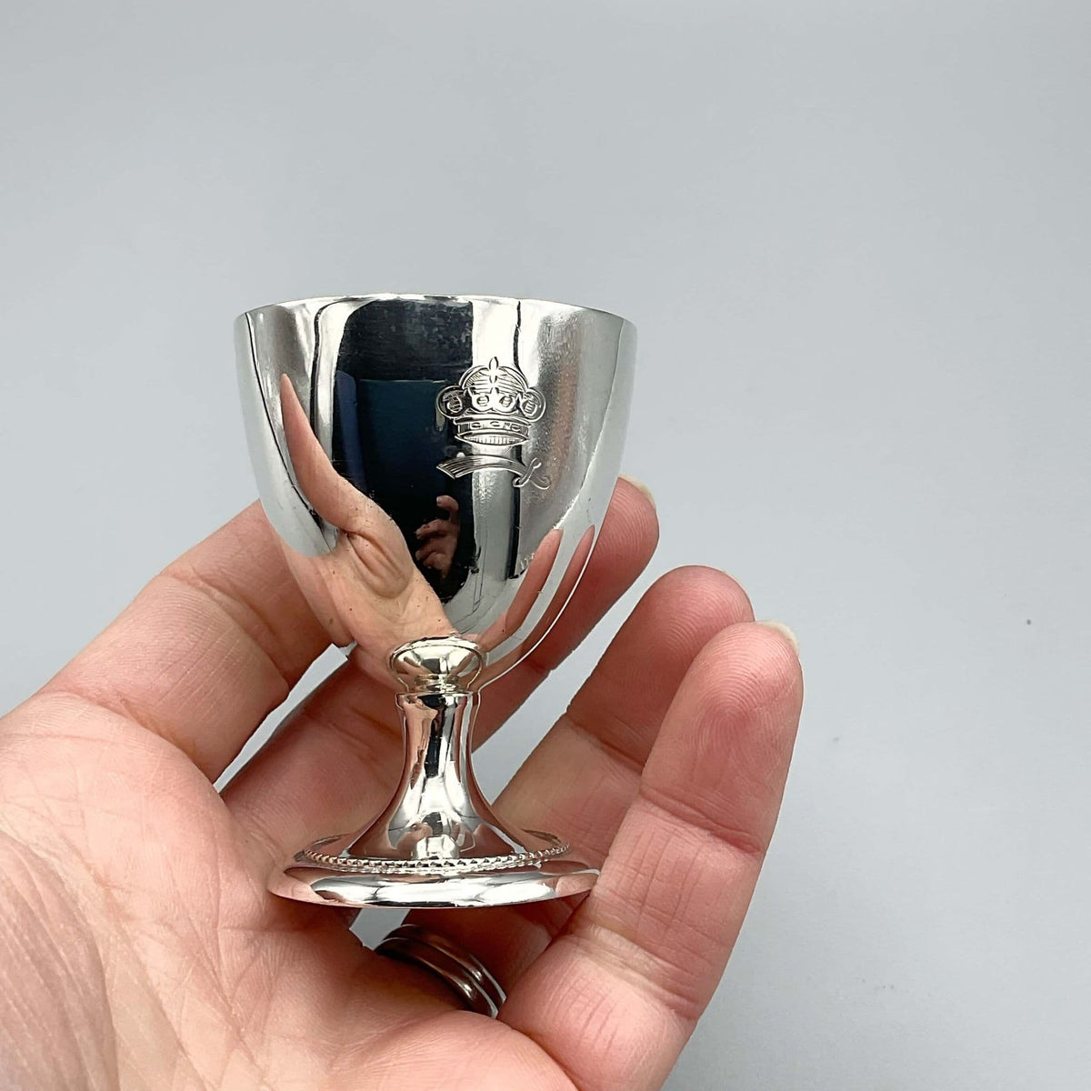 Sterling silver egg cup from 1944 by Beeches Vintage, ideal for christening or baby gift, with detailed engraved design.
