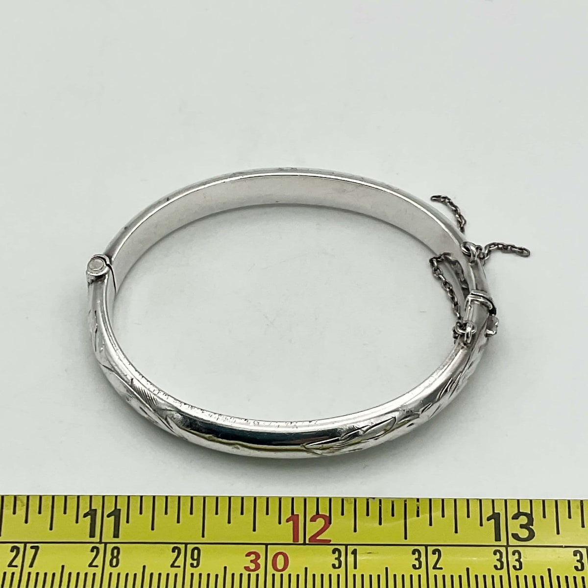 Sterling silver baby or child's bracelet from 1968 by Beeches Vintage with intricate detailing and secure clasp.