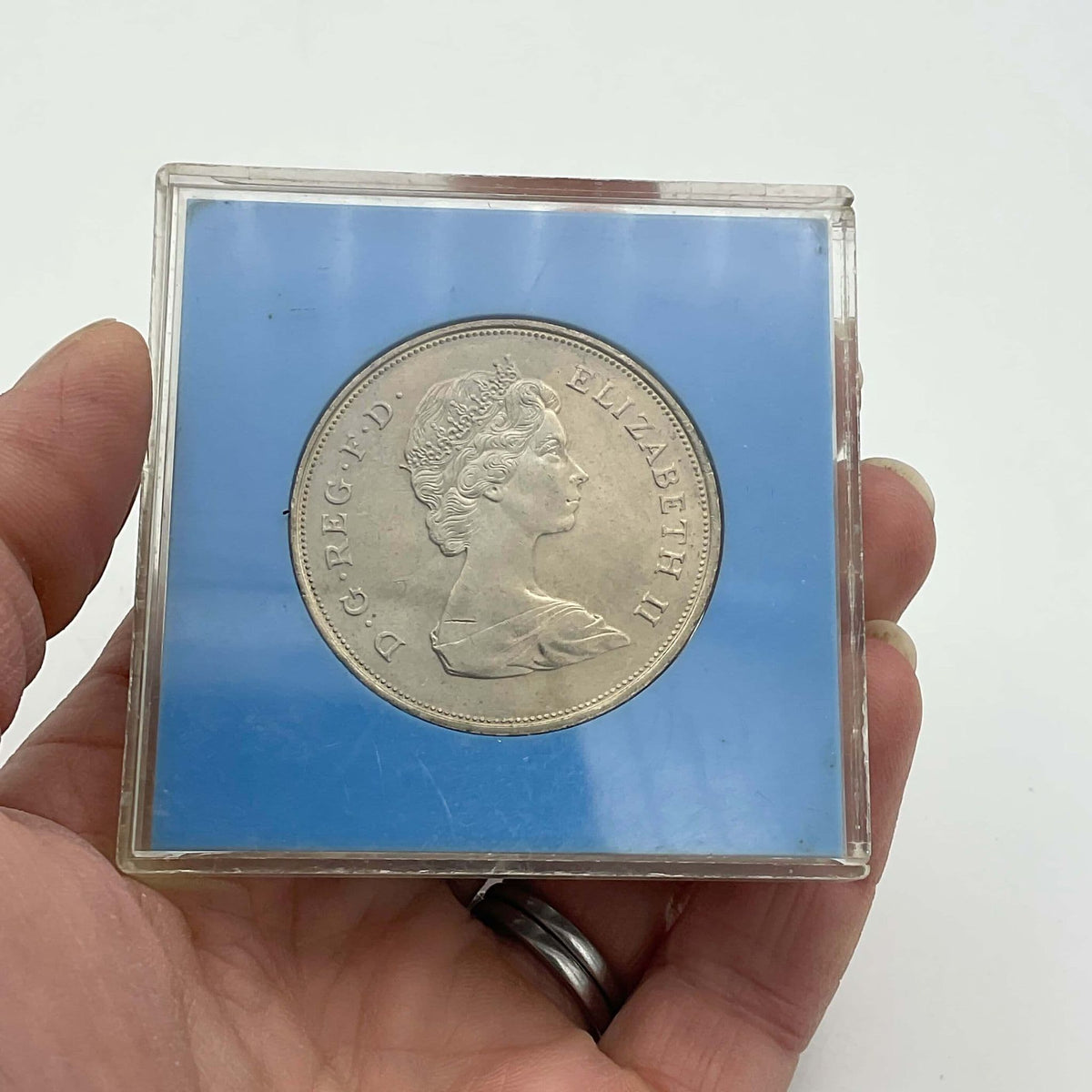 1980 Queen Mother 80th Birthday commemorative coin by Beeches Vintage, featuring Queen Mother’s portrait and celebratory inscription.