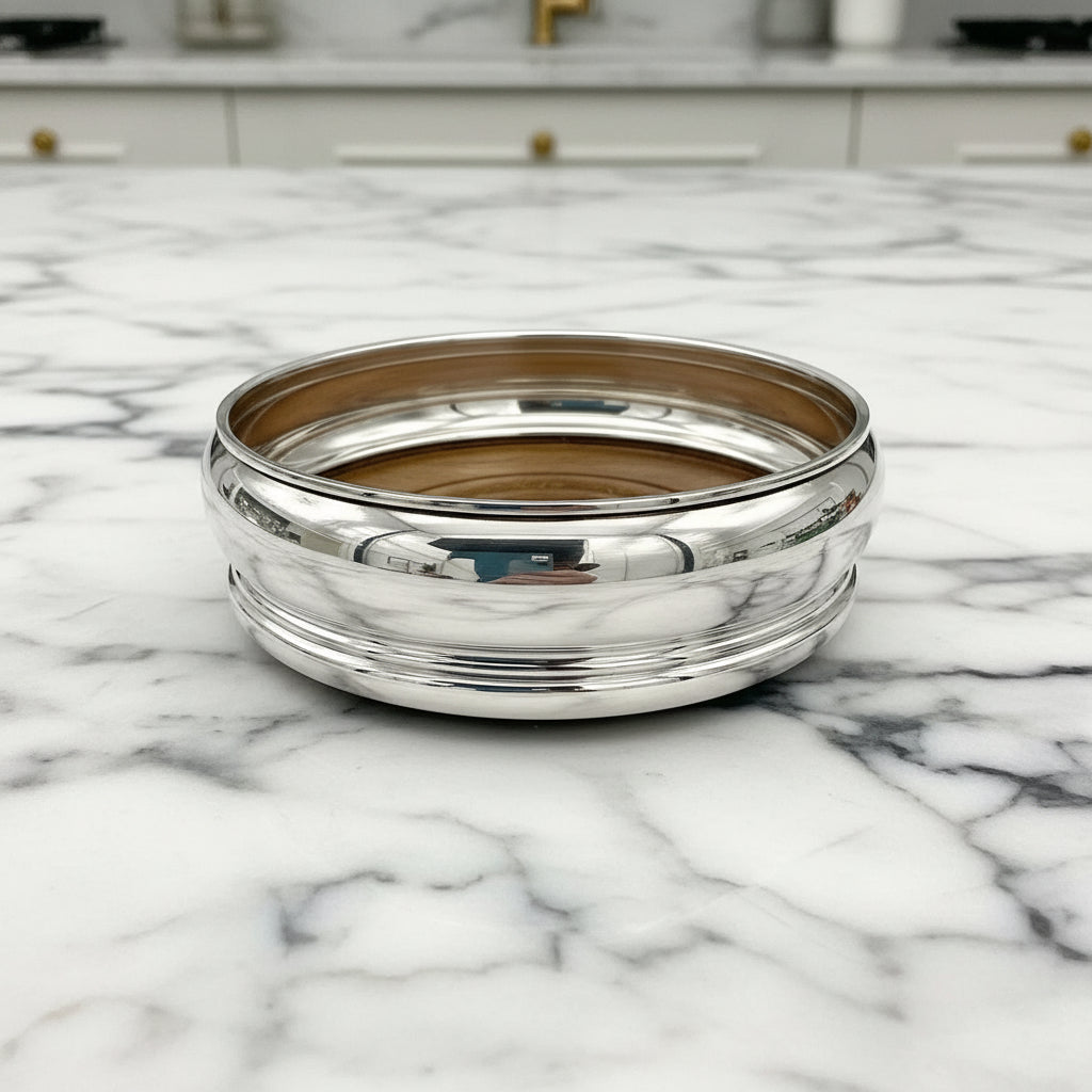 Vintage sterling silver wine bottle coaster by Beeches Vintage, featuring intricate design and classic craftsmanship.