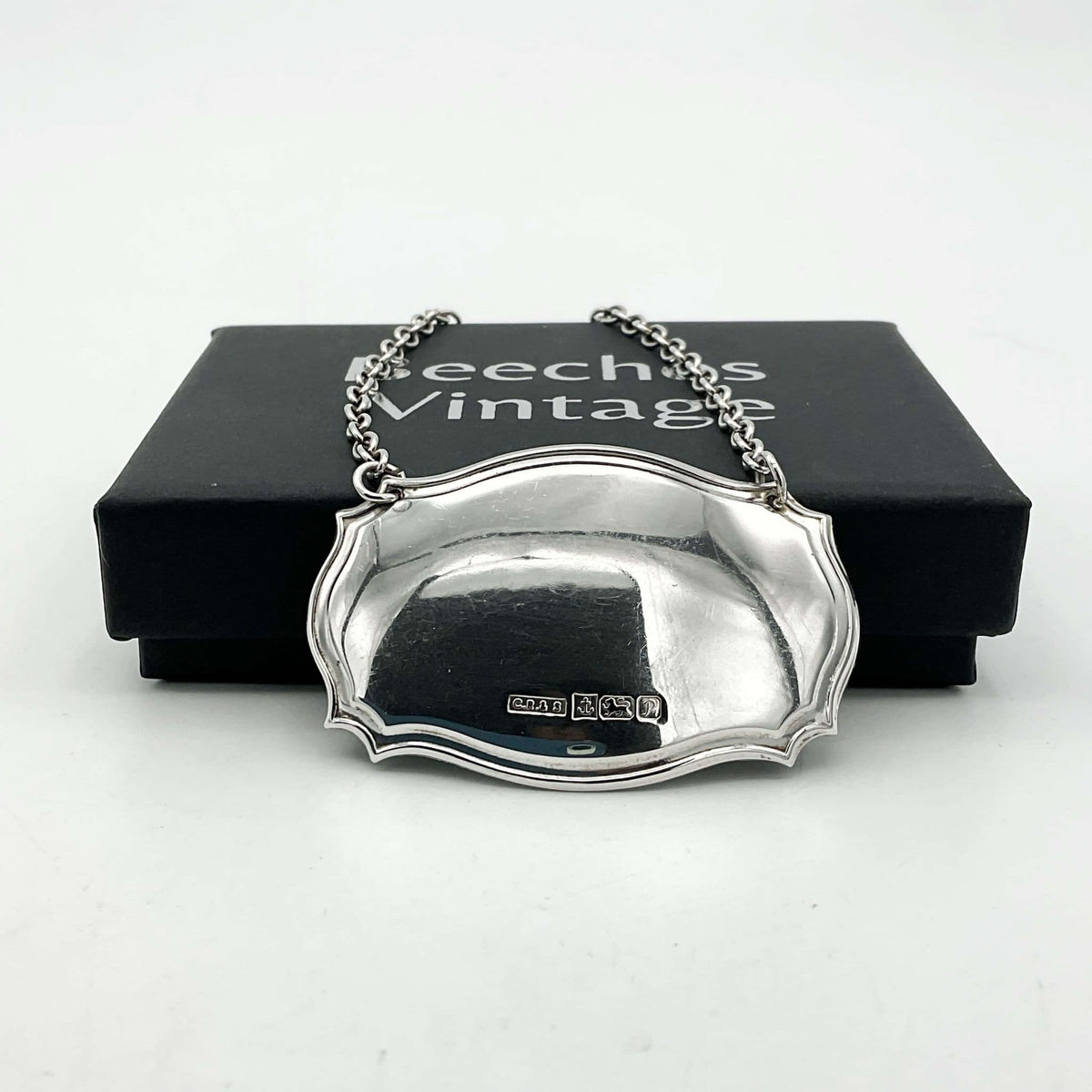 Sterling silver decanter label with "1989" engraved, vintage Beeches Vintage decanter label for elegant bottle identification.