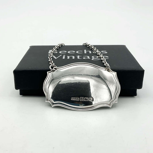 Sterling silver decanter label with "1989" engraved, vintage Beeches Vintage decanter label for elegant bottle identification.