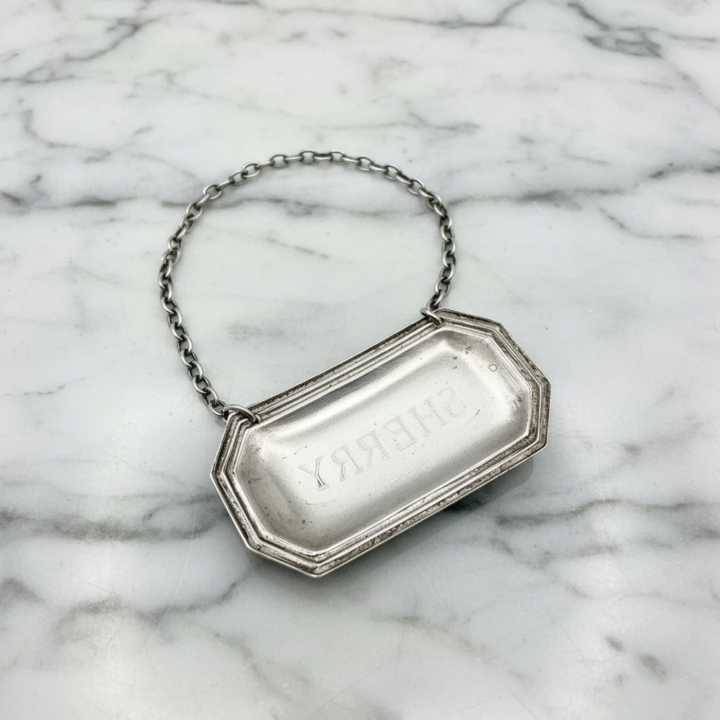back of siler decanter label on a marble worktop