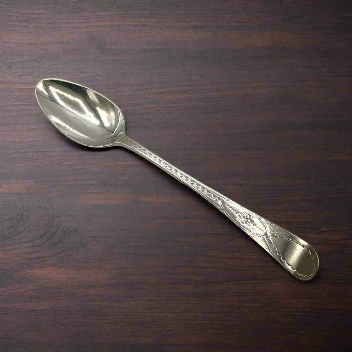 Antique 1793 Georgian Sterling Silver Teaspoon on wood table