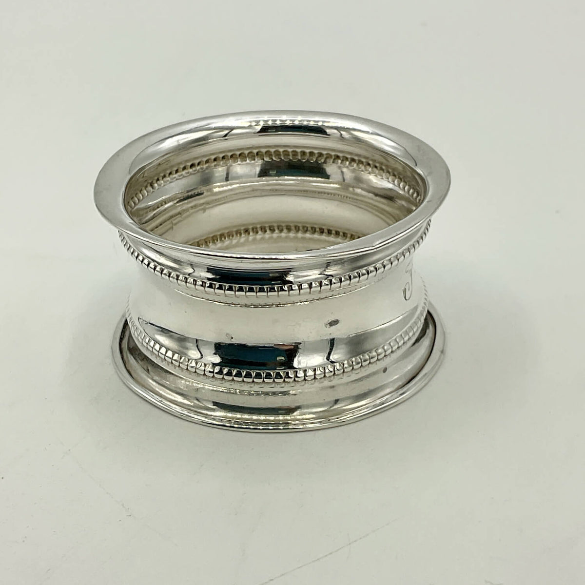 Antique 1912 Sterling Silver Napkin Ring on a white surface
