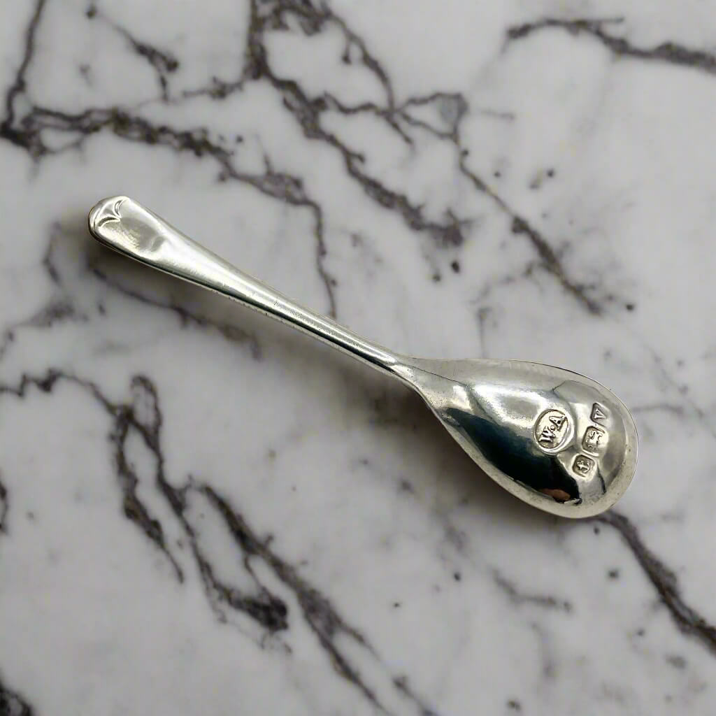 Silver spoon on a marble surface