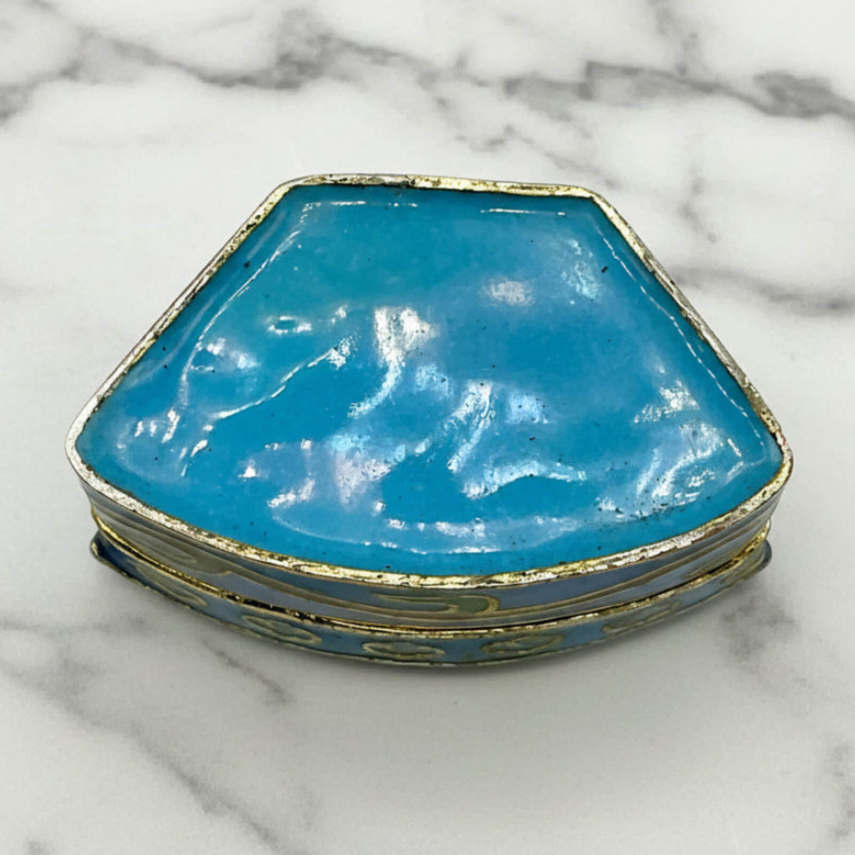 Chinese Cloisonné Enamel Pill Box base on a marble surface
