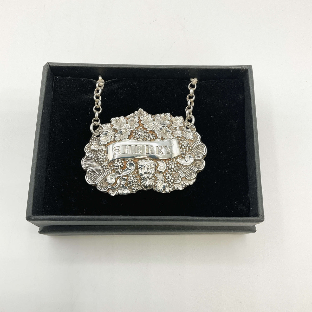 Silver Sherry decanter label black box on a white background