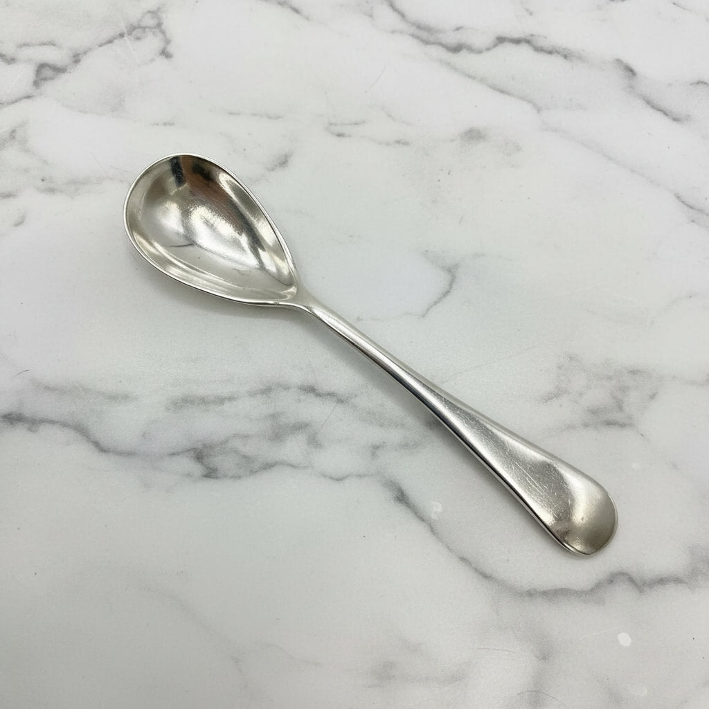 silver spoon on a marble surface