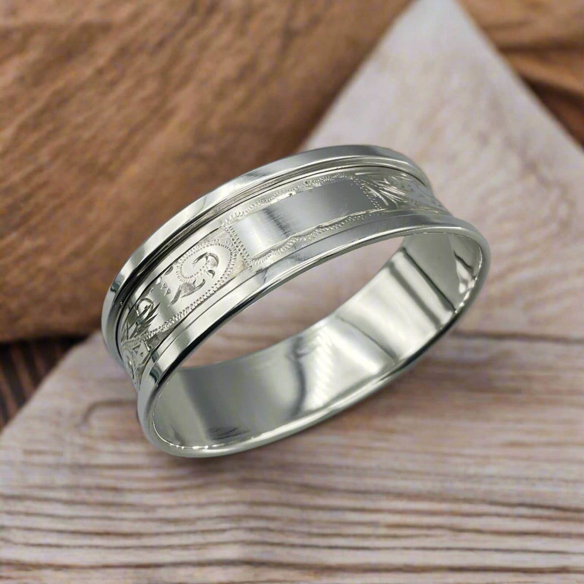 Vintage 1975 Beeches Vintage sterling silver napkin ring with intricate design and polished finish.