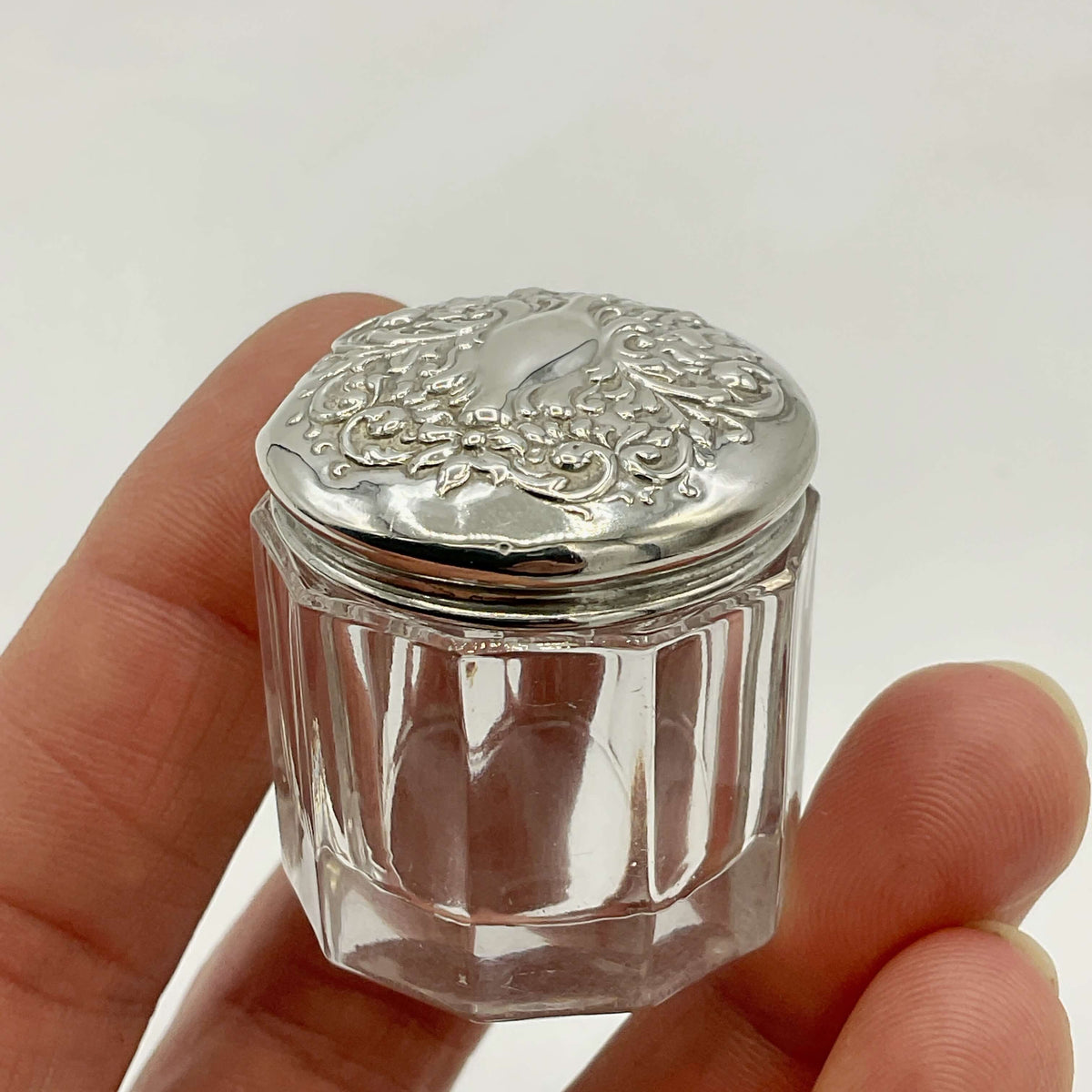 Antique Sterling Silver Glass Jar by Beeches Vintage, showcasing a detailed silver lid and clear glass body.