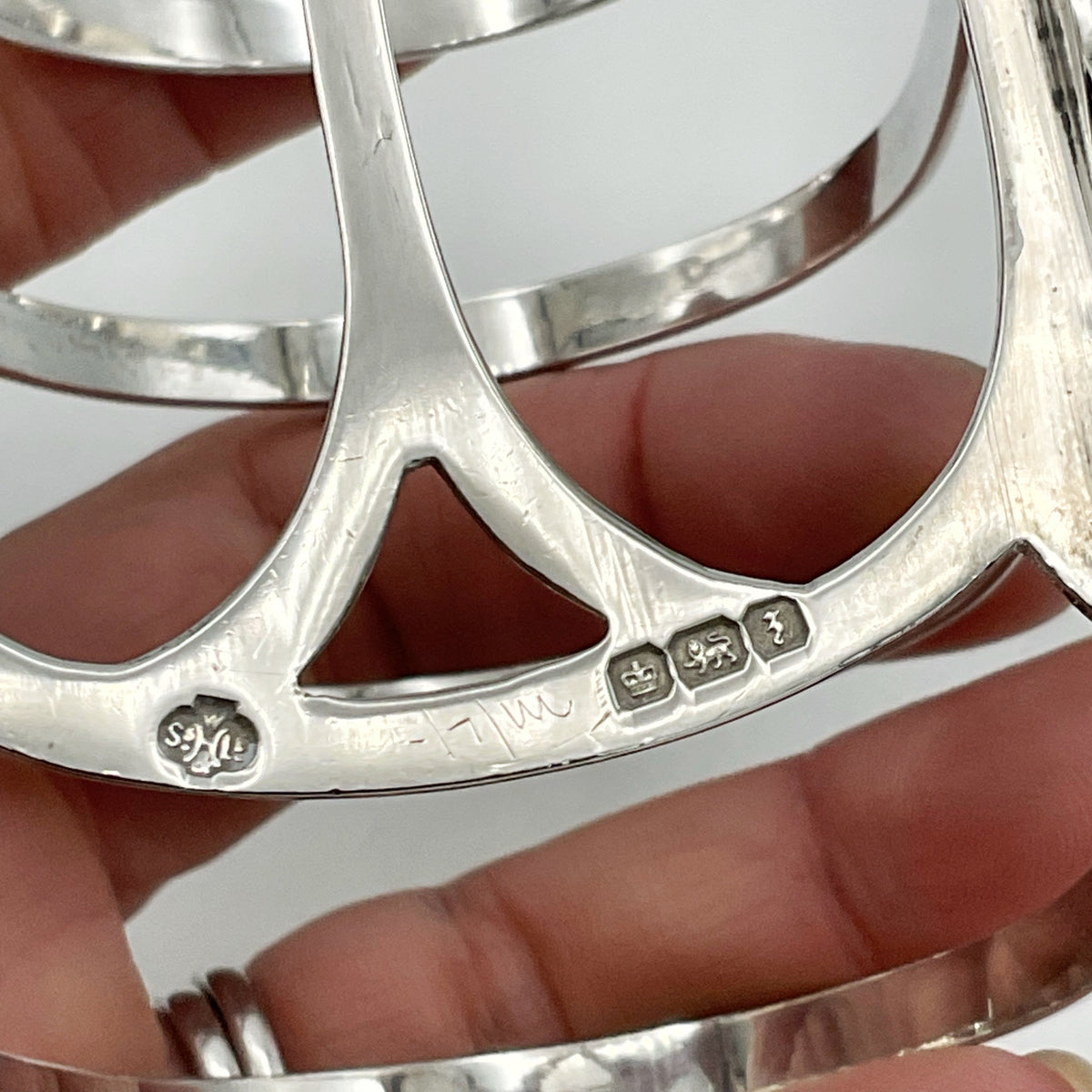 hallmarks on toast rack held in hand