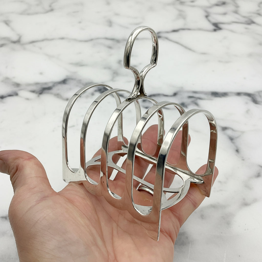 toast rack held in hand with marble background
