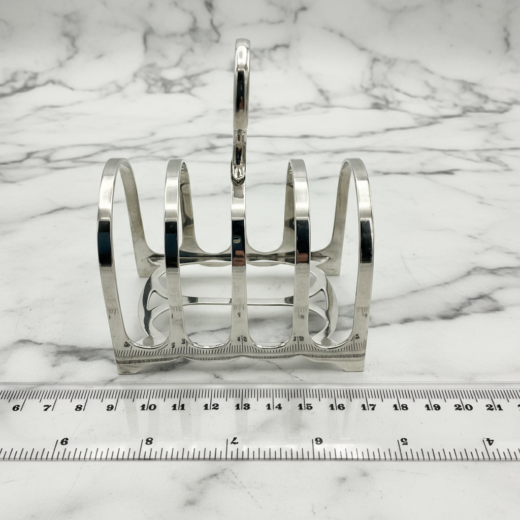 toast rack next to ruler for scale on marble
