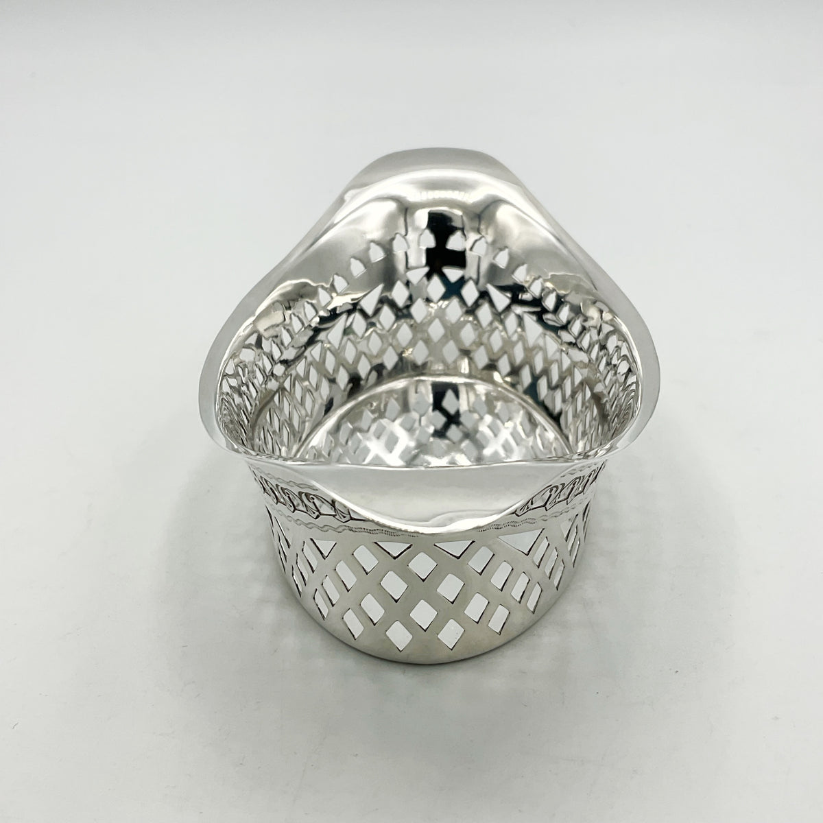 End of Silver pierced bowl showing lip handle