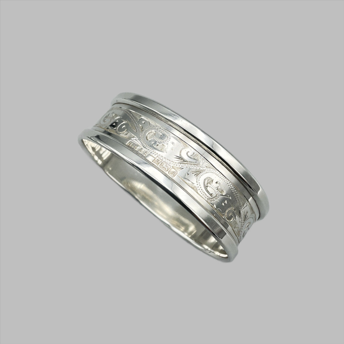 Engraved silver napkin ring showing the hallmarks and makers marks