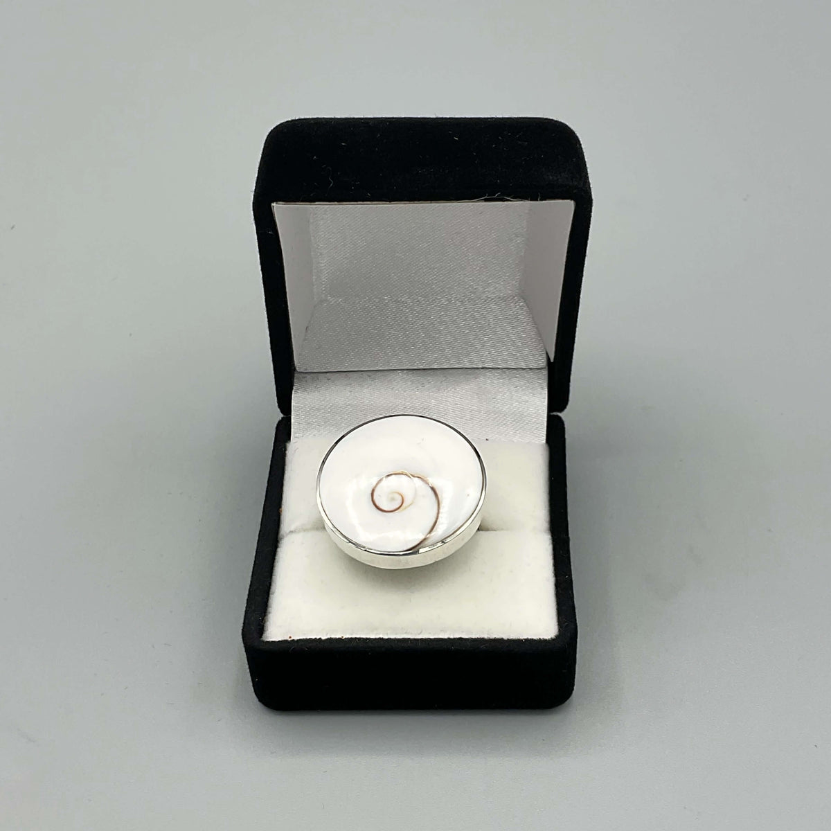 Silver enamel ring from Beeches Vintage featuring a detailed design, displayed on a neutral background.