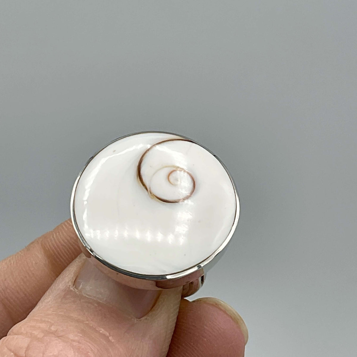 Silver enamel ring with intricate design from Beeches Vintage, showcasing a stylish and detailed jewelry piece.