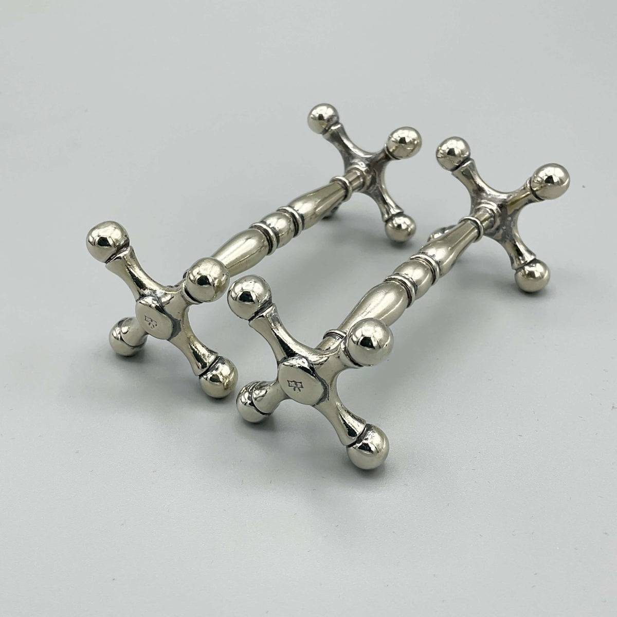 Antique Victorian silver-plated knife rests with intricate detailing, crafted by Beeches Vintage for elegant table settings.