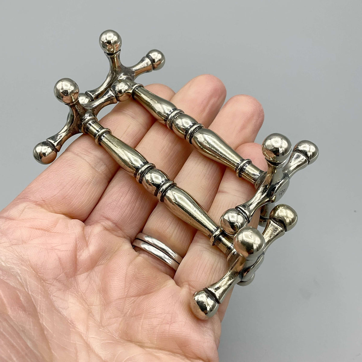 Antique Victorian silver-plated knife rests with ornate design, perfect for elegant table settings by Beeches Vintage.