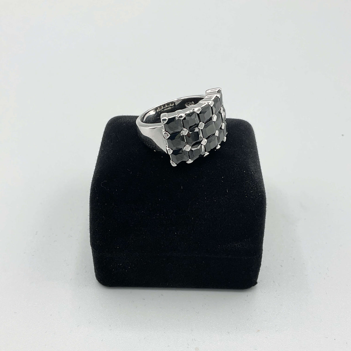 Black cubic zirconia silver ring with intricate band design by Beeches Vintage, showcasing a sparkling black stone.