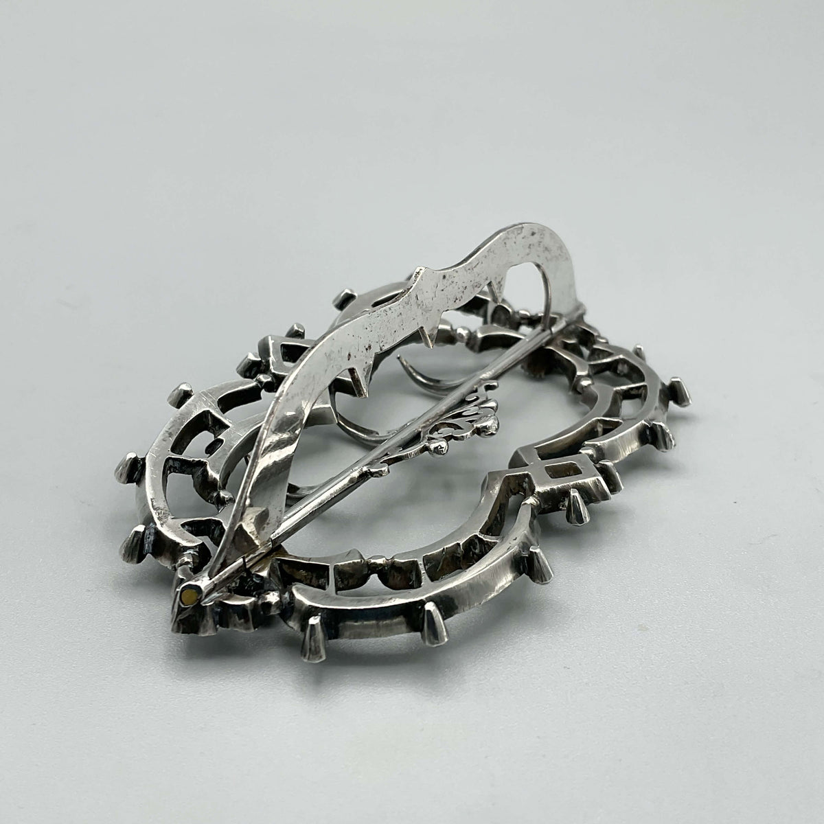 Antique cubic zirconia hair clip from Beeches Vintage, elegant hair accessory with sparkling stones and intricate metalwork.