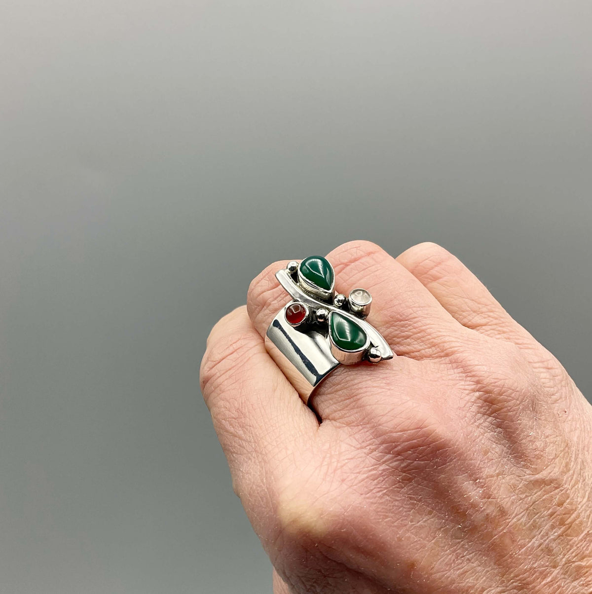 Multicoloured agate silver ring featuring vibrant stones set in a detailed band, crafted by Beeches Vintage.