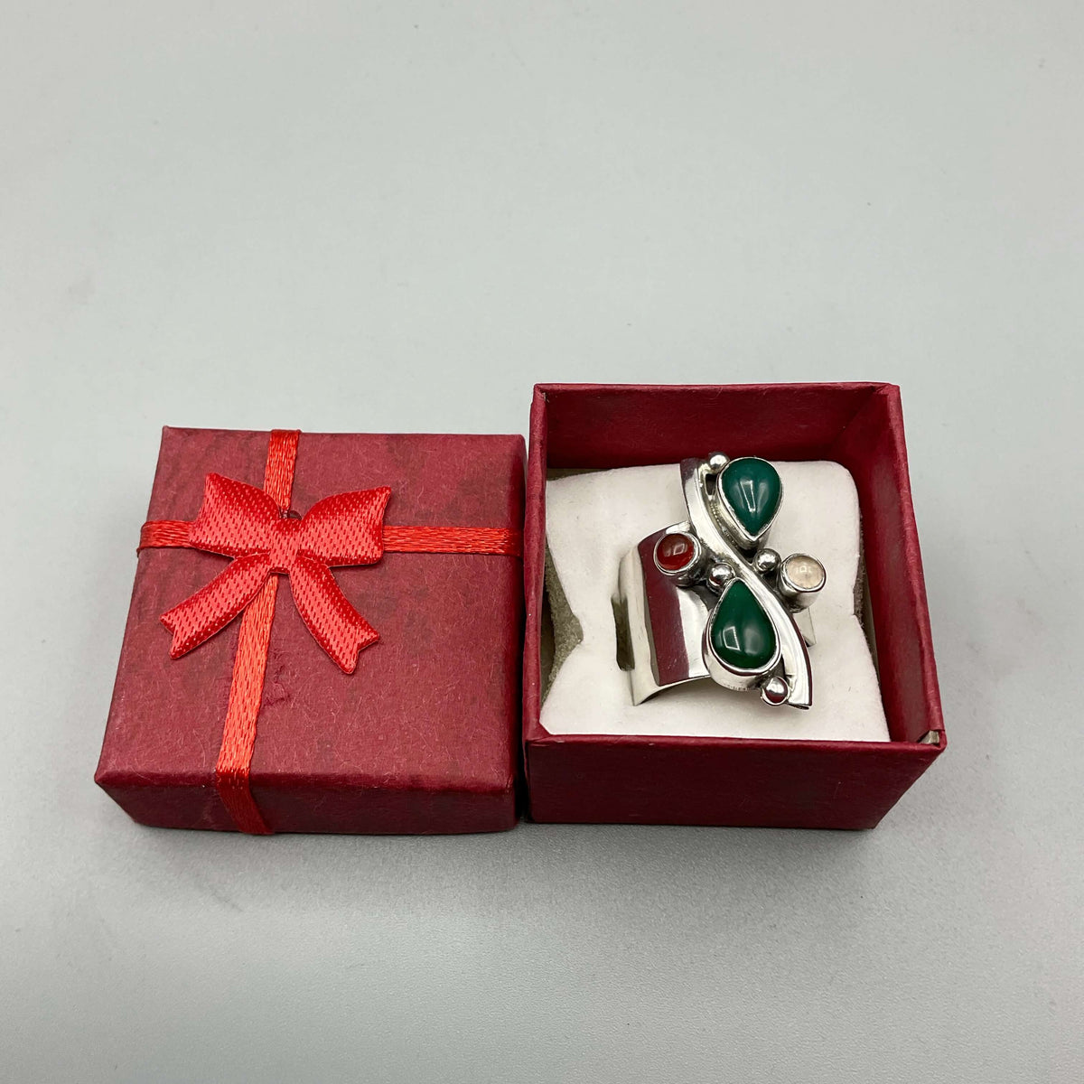 Multicoloured agate silver ring with intricate band design from Beeches Vintage, showcasing vibrant gemstone and detailed craftsmanship.