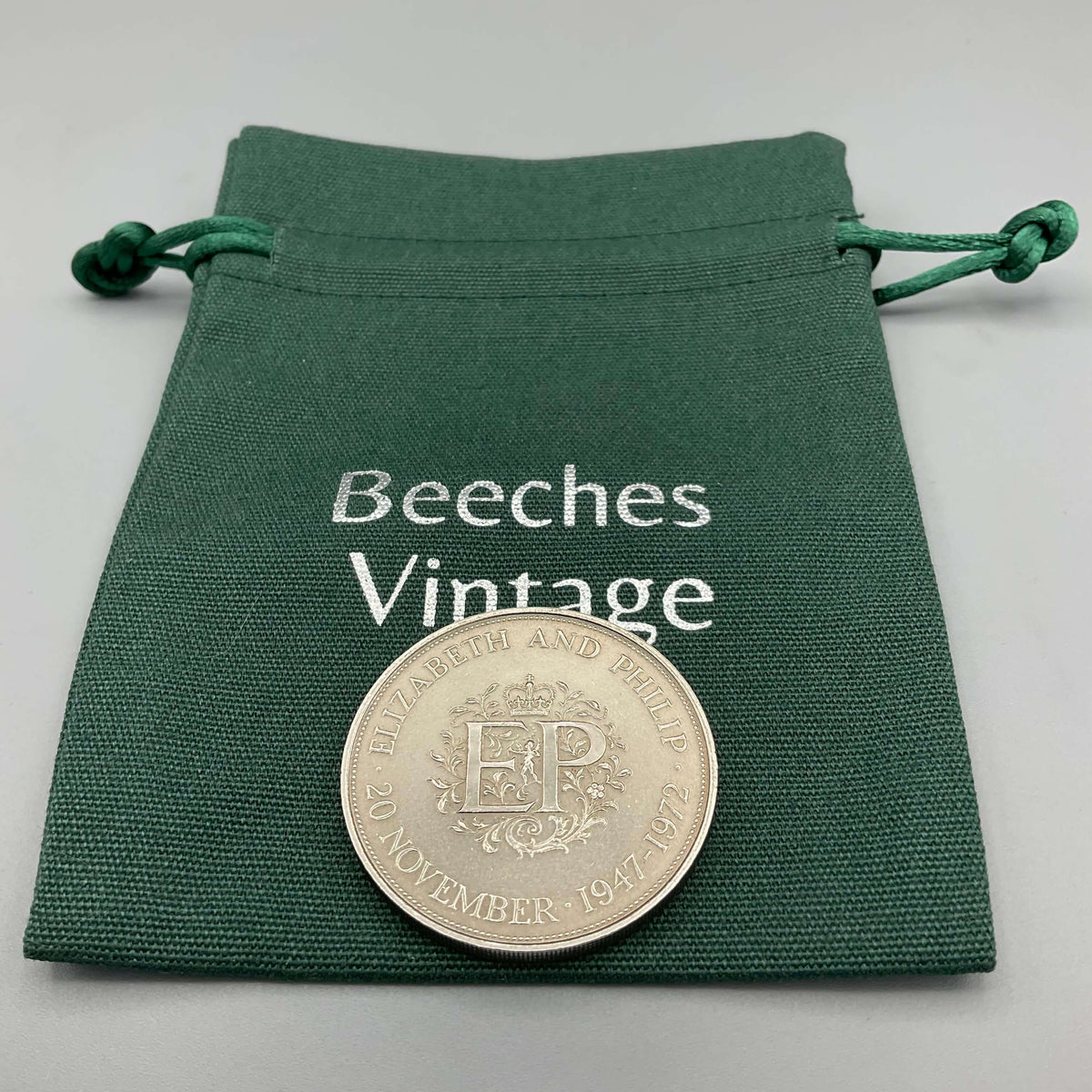 Silver wedding anniversary coin featuring Queens 1972 design by Beeches Vintage, close-up of the detailed engraved surface.