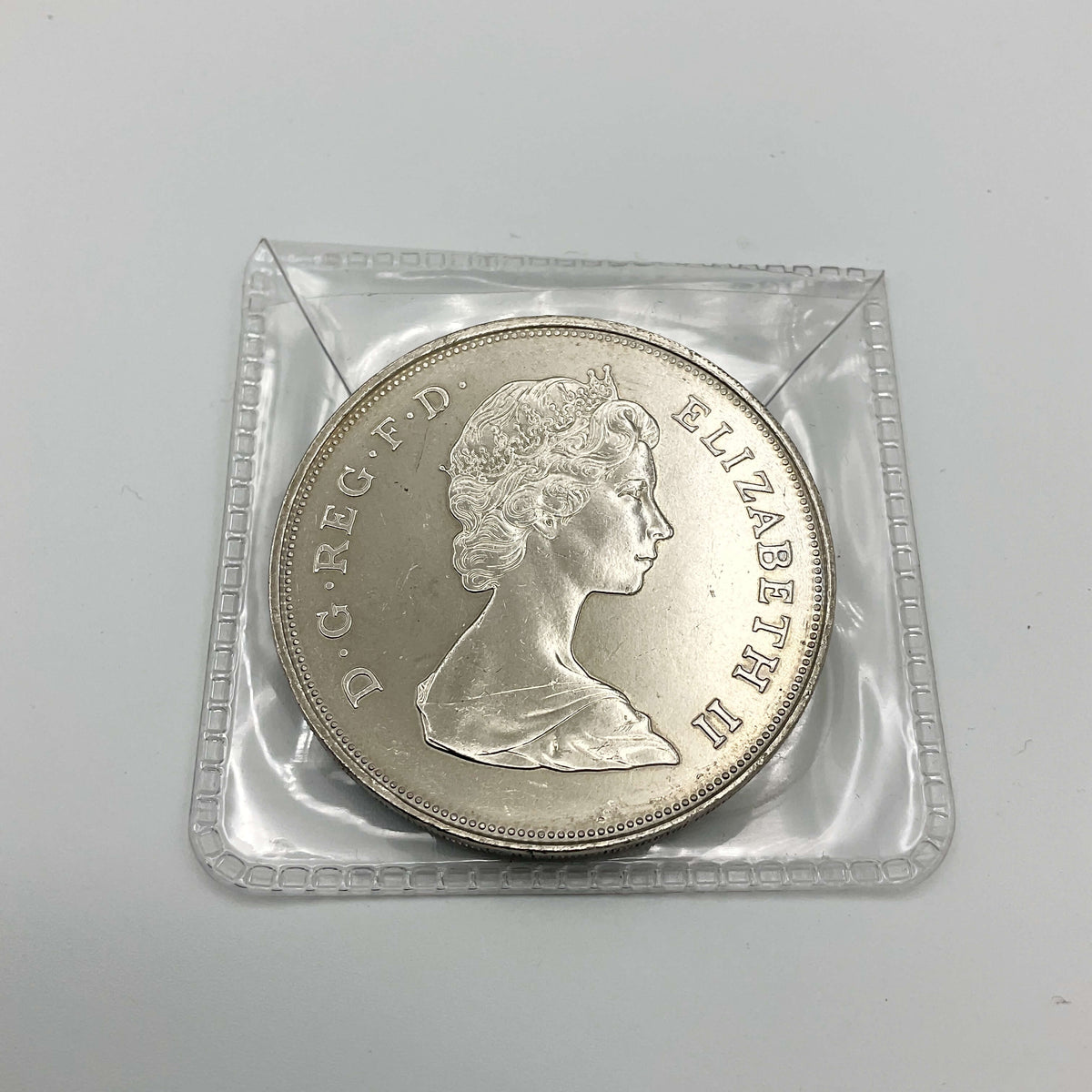 Charles and Diana 1981 Royal Wedding coin by Beeches Vintage, featuring detailed images of the commemorative coin.