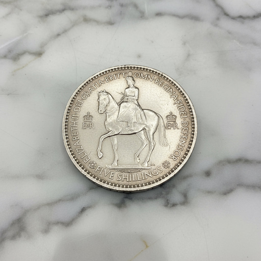 reverse side of 1953 Queen Elizabeth II coronation Coin on marble