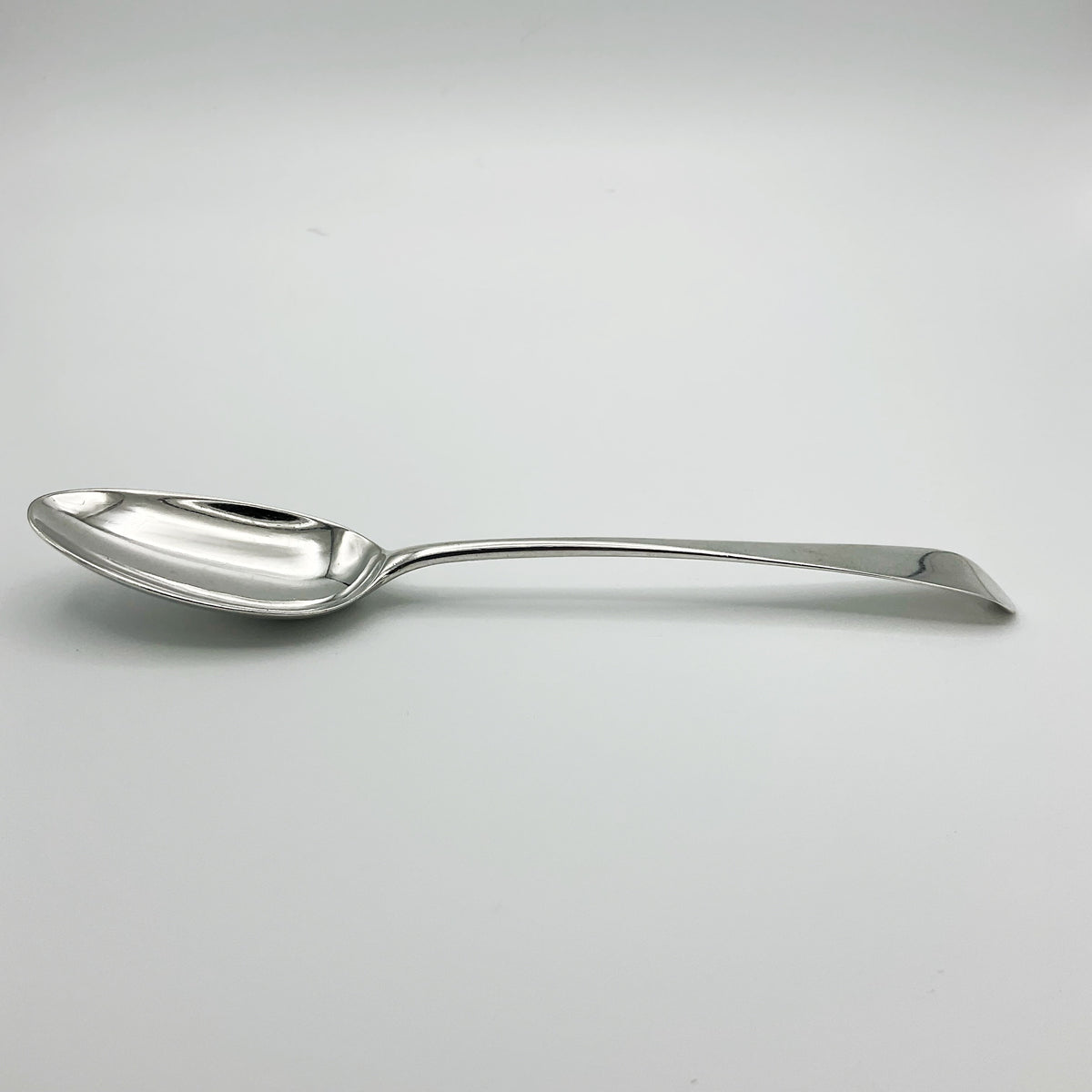 Antique Georgian 1788 silver serving spoon with ornate handle, crafted by Beeches Vintage, showcasing intricate vintage silverware design.