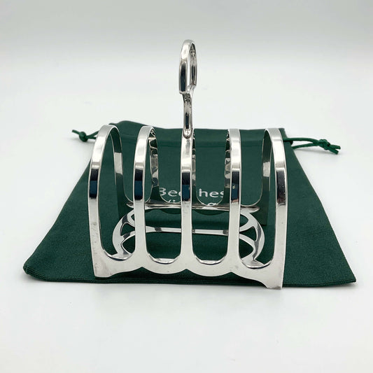 Antique 1912 Sterling Silver Toast Rack with intricate detailing, crafted by Beeches Vintage, showcasing vintage elegance and craftsmanship.