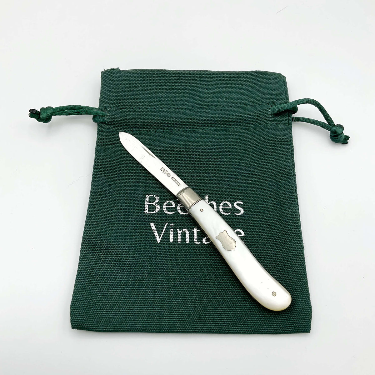 Vintage 1925 Beeches Vintage sterling silver fruit knife with ornate handle and sharp blade, classic antique cutlery piece.