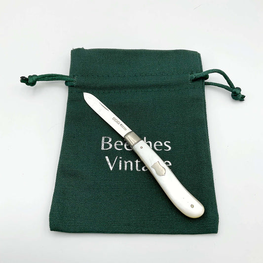 Vintage 1925 Beeches Vintage sterling silver fruit knife with ornate handle and sharp blade, classic antique cutlery piece.