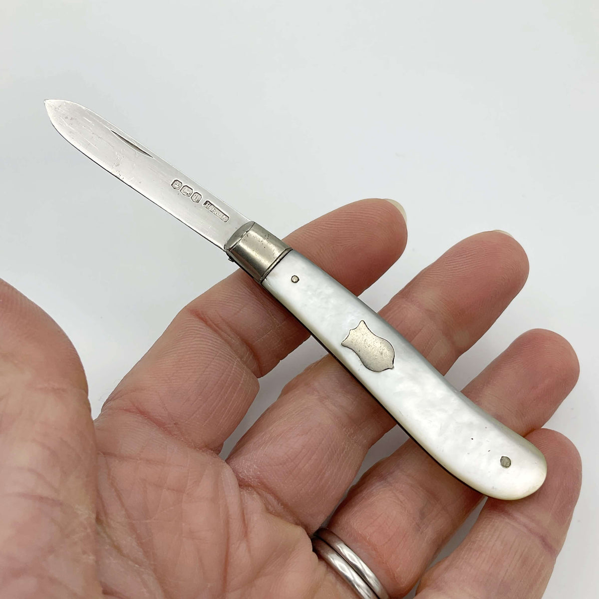 Vintage 1925 Beeches Vintage sterling silver fruit knife with ornate handle and blade, classic antique cutlery for fruit serving.