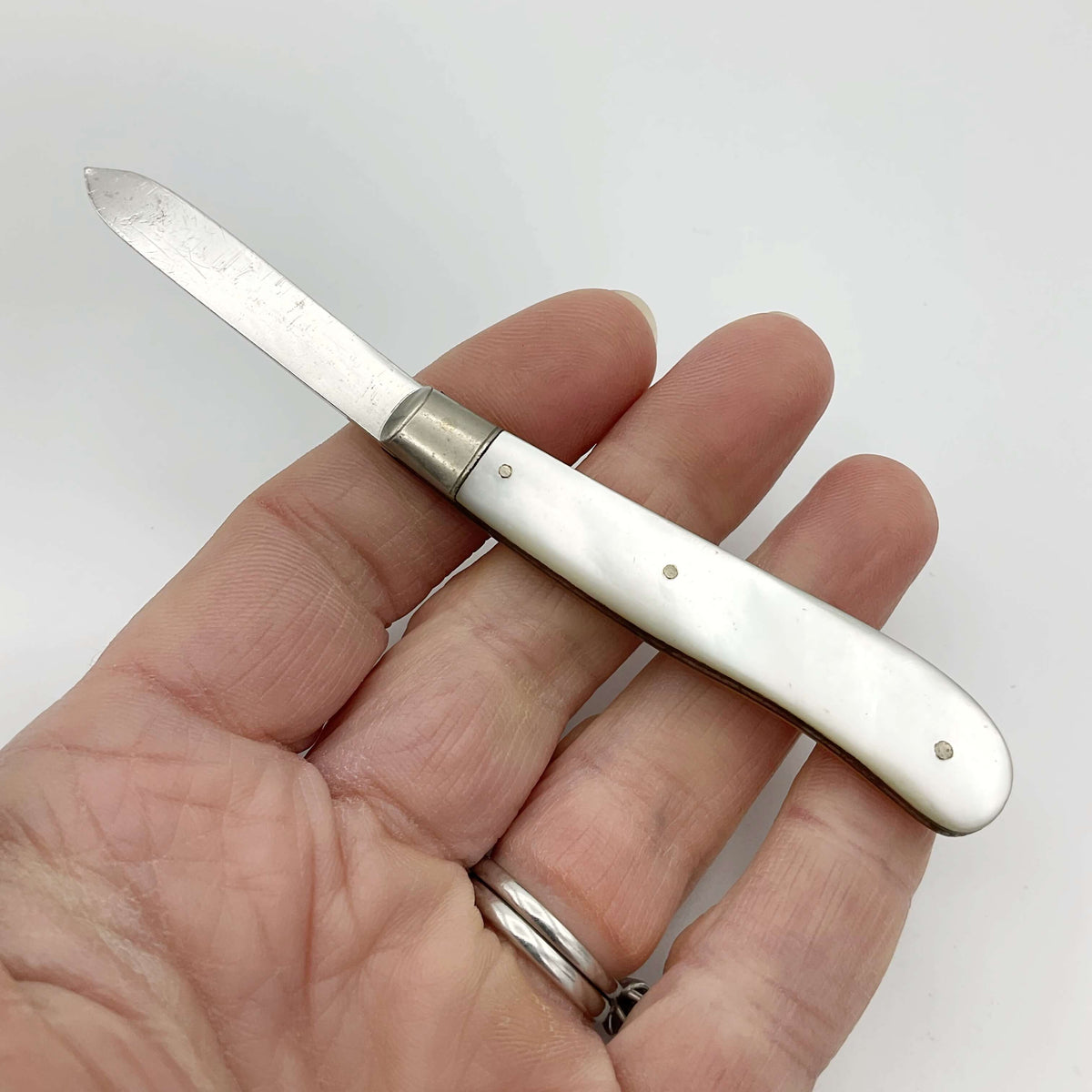 Vintage 1925 Beeches Vintage sterling silver fruit knife with ornate handle and blade, classic antique cutlery piece.