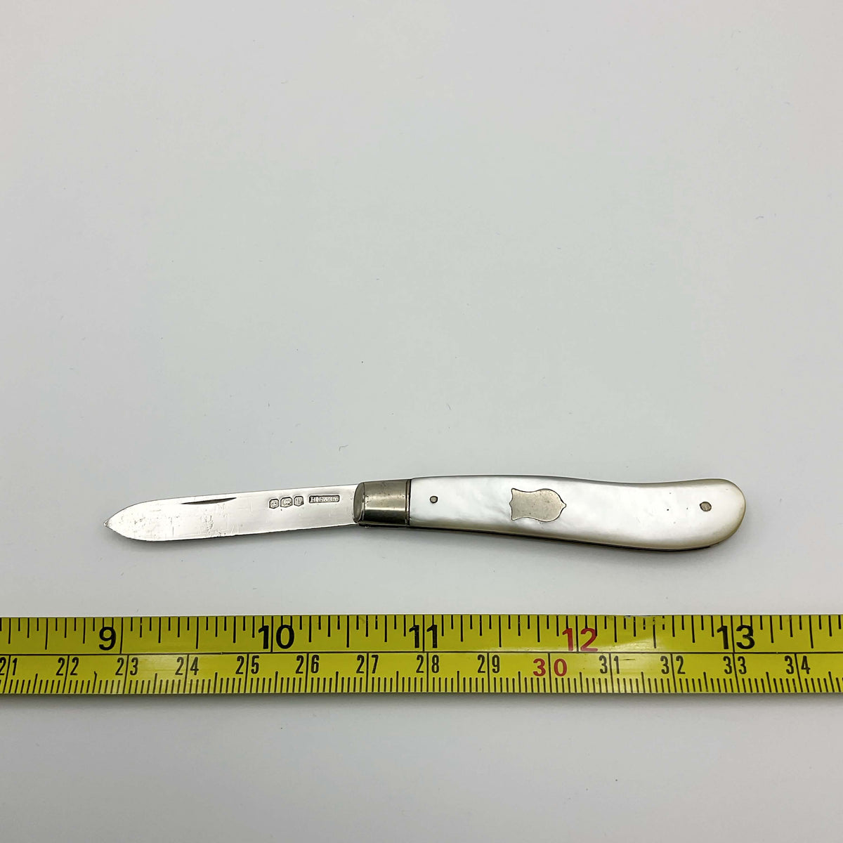 Vintage 1925 Beeches Vintage sterling silver fruit knife with ornate handle and blade, classic antique cutlery design.