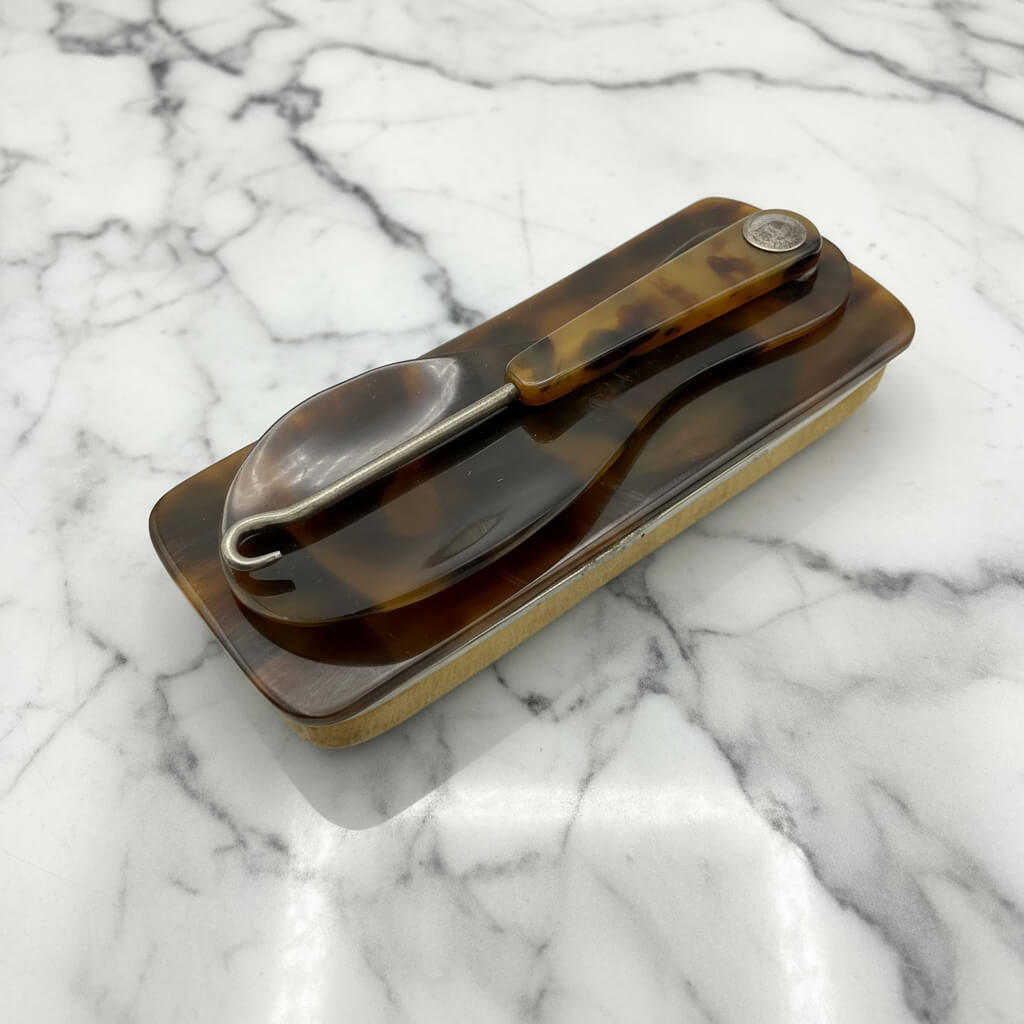 vintage Shoe hook horn and buffer on marble background