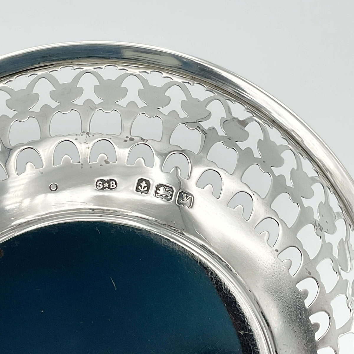 Birmingham anchor hallmark and SB makers mark on bowl base with a white background