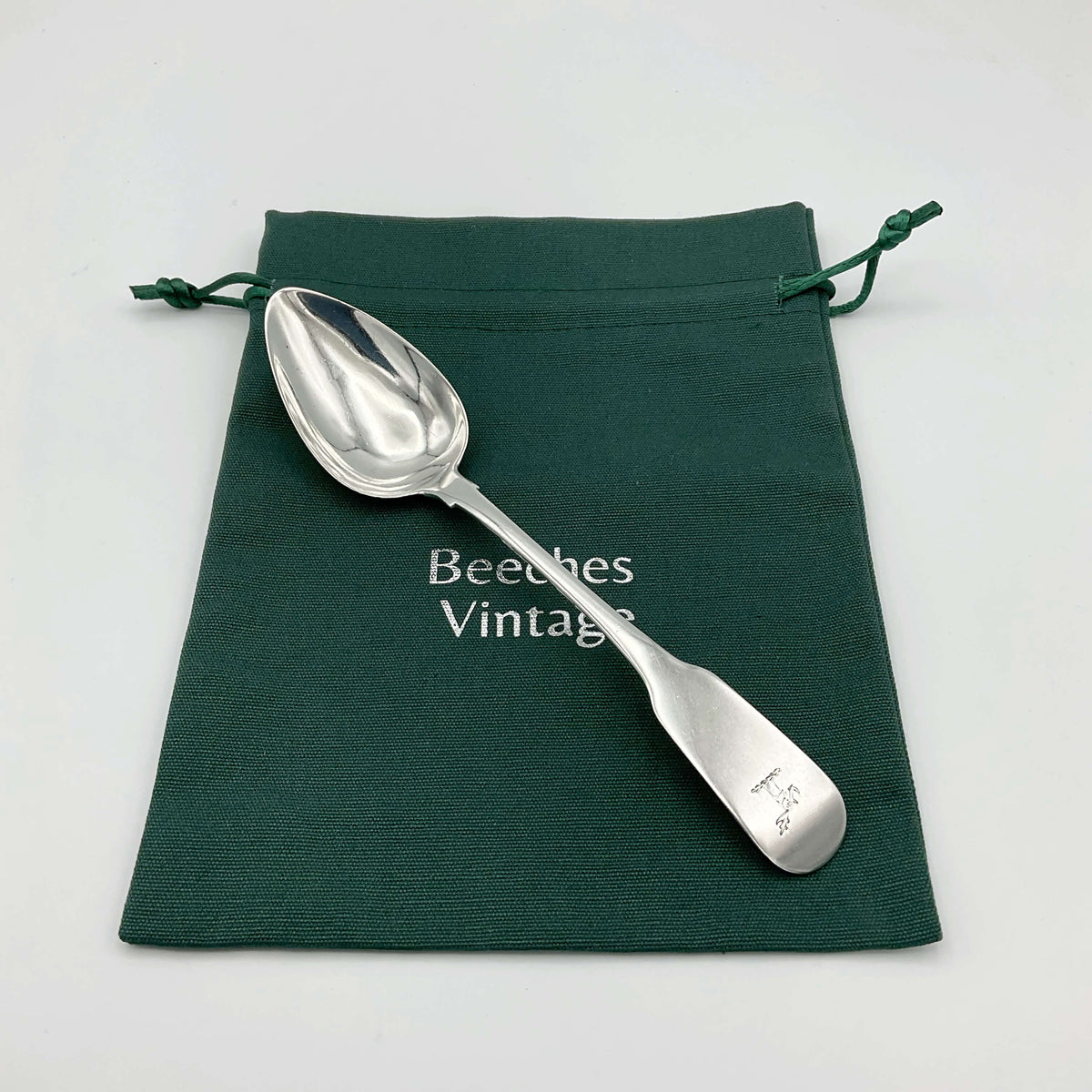 Antique 1813 Sterling Silver Dessert Spoon by Beeches Vintage, featuring intricate engraved details and a polished finish.