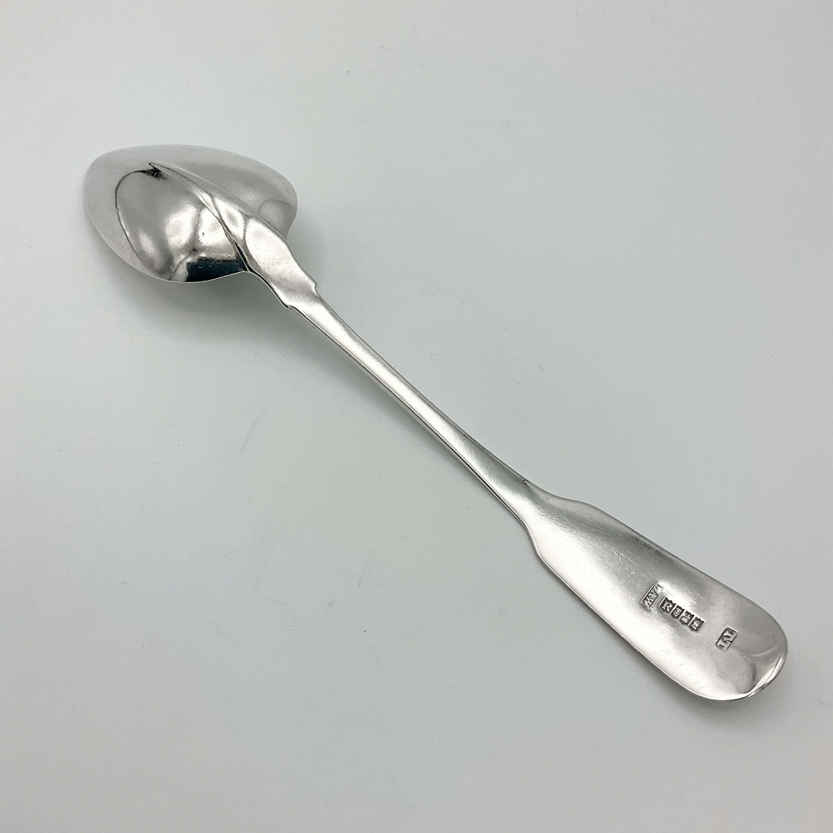 Antique 1813 sterling silver dessert spoon by Beeches Vintage, featuring intricate engraved details on a polished handle.