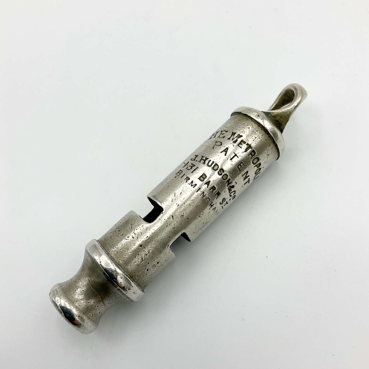 Antique police whistle from Beeches Vintage featuring classic metal design, used as a vintage accessories piece.