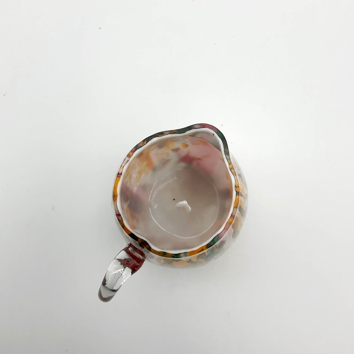 Small handmade vintage art glass cream jug by Beeches Vintage, featuring elegant craftsmanship and a delicate design.
