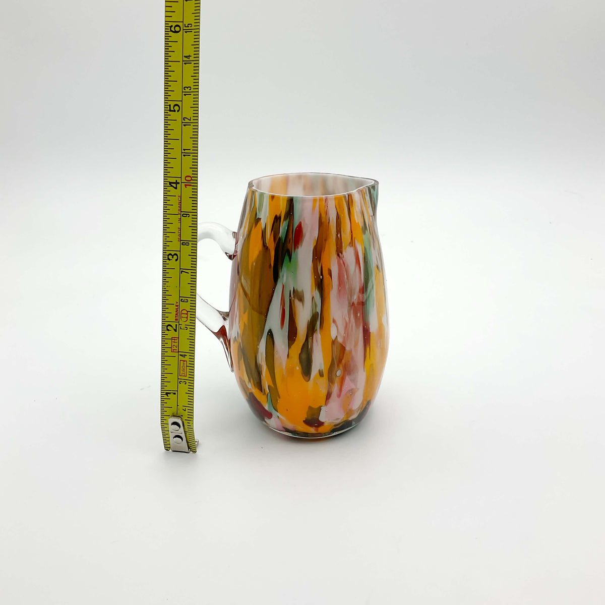 Small handmade vintage art glass cream jug by Beeches Vintage, featuring intricate glasswork and a classic design.