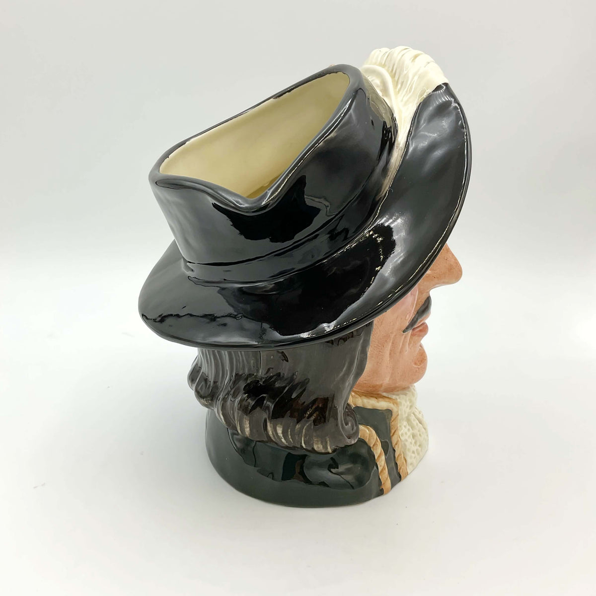 Side view of Large Royal Doulton Athos Toby Jug on a plain background