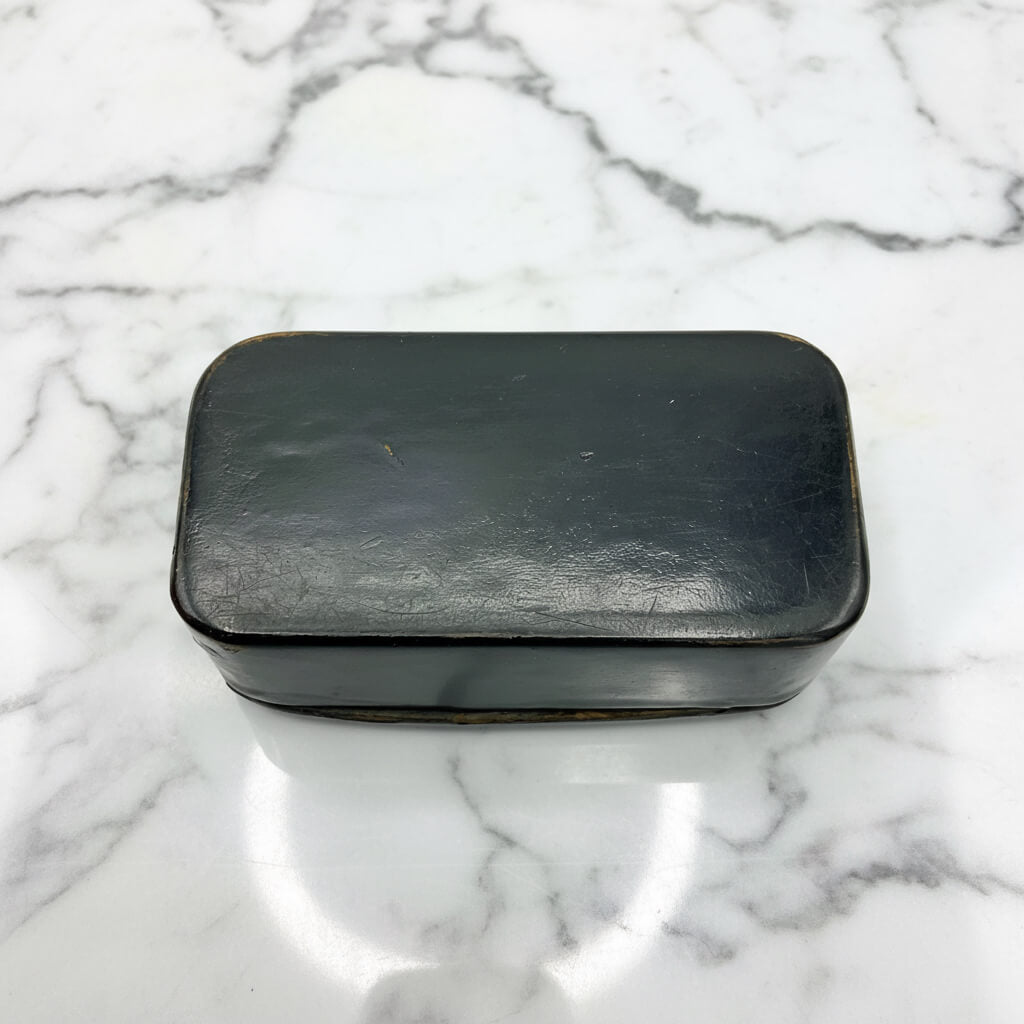 Base of Antique snuff box on a white background